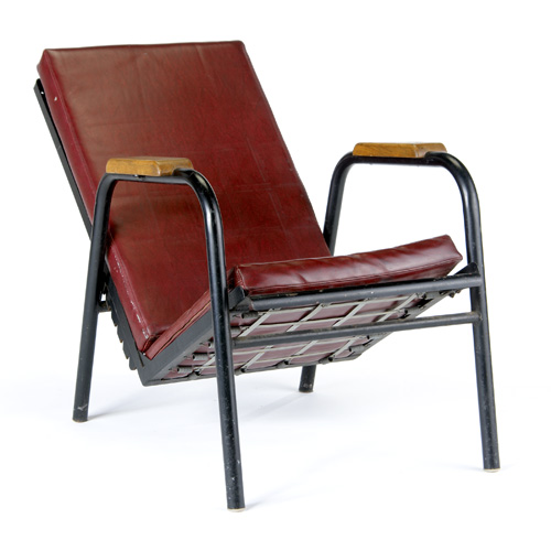 Appraisal: PAUL NELSON Armchair with red leather upholstery on adjustable enameled