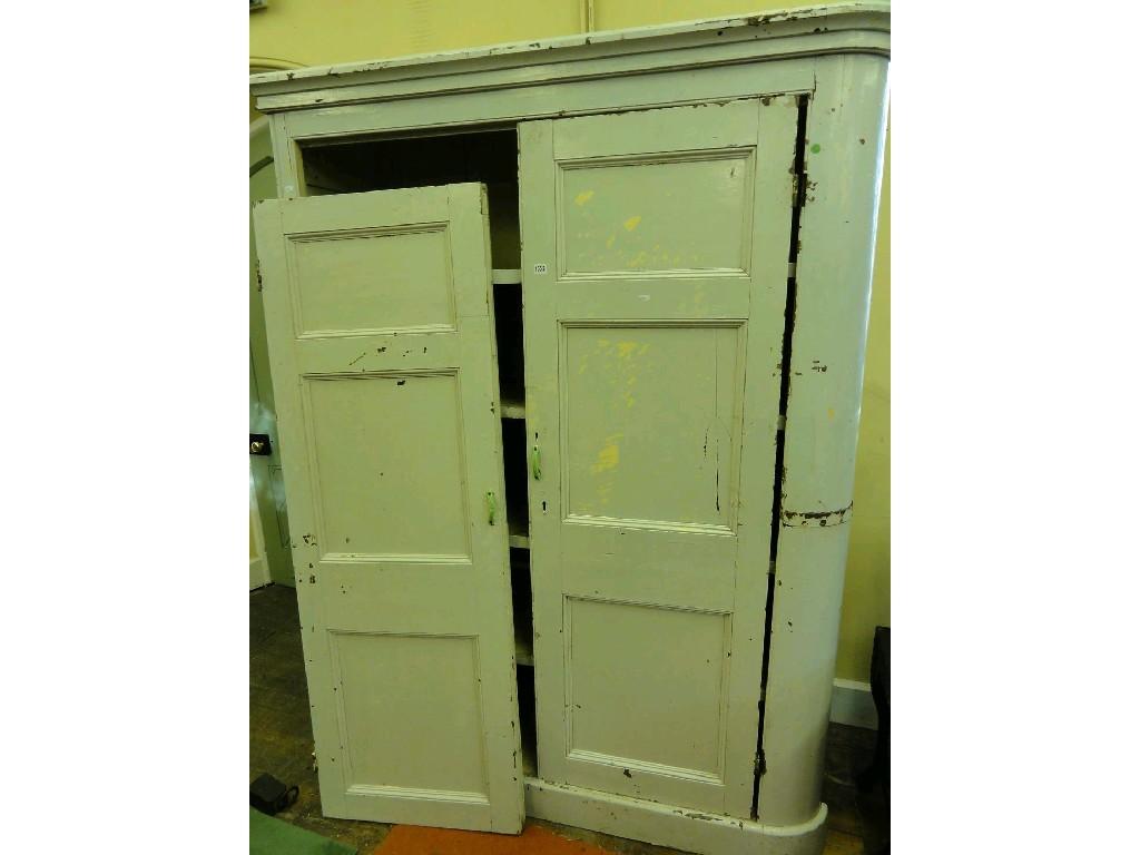 Appraisal: A painted pine house keepers cupboard with single bowed end