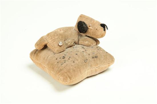 Appraisal: PINCUSHION American th century velvet Recumbent dog with glass eyes