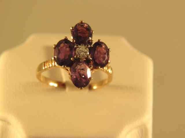 Appraisal: Amethyst Diamond Ring four oval gems with diamond in center