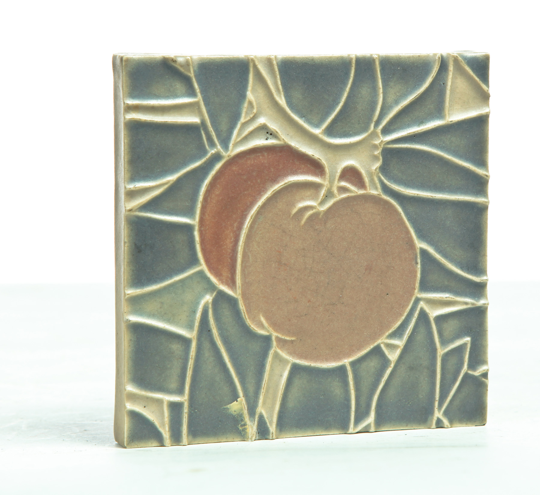 Appraisal: ROOKWOOD TILE TRIVET American dated Blue tan and rust glaze