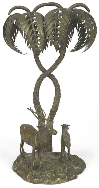 Appraisal: A bronze table centerpiece modeled with two stags and palms