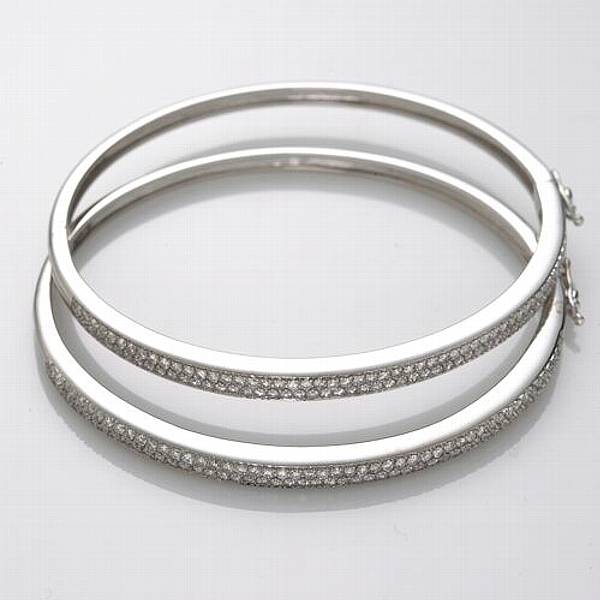 Appraisal: A pair of diamond and k white gold bangle bracelets