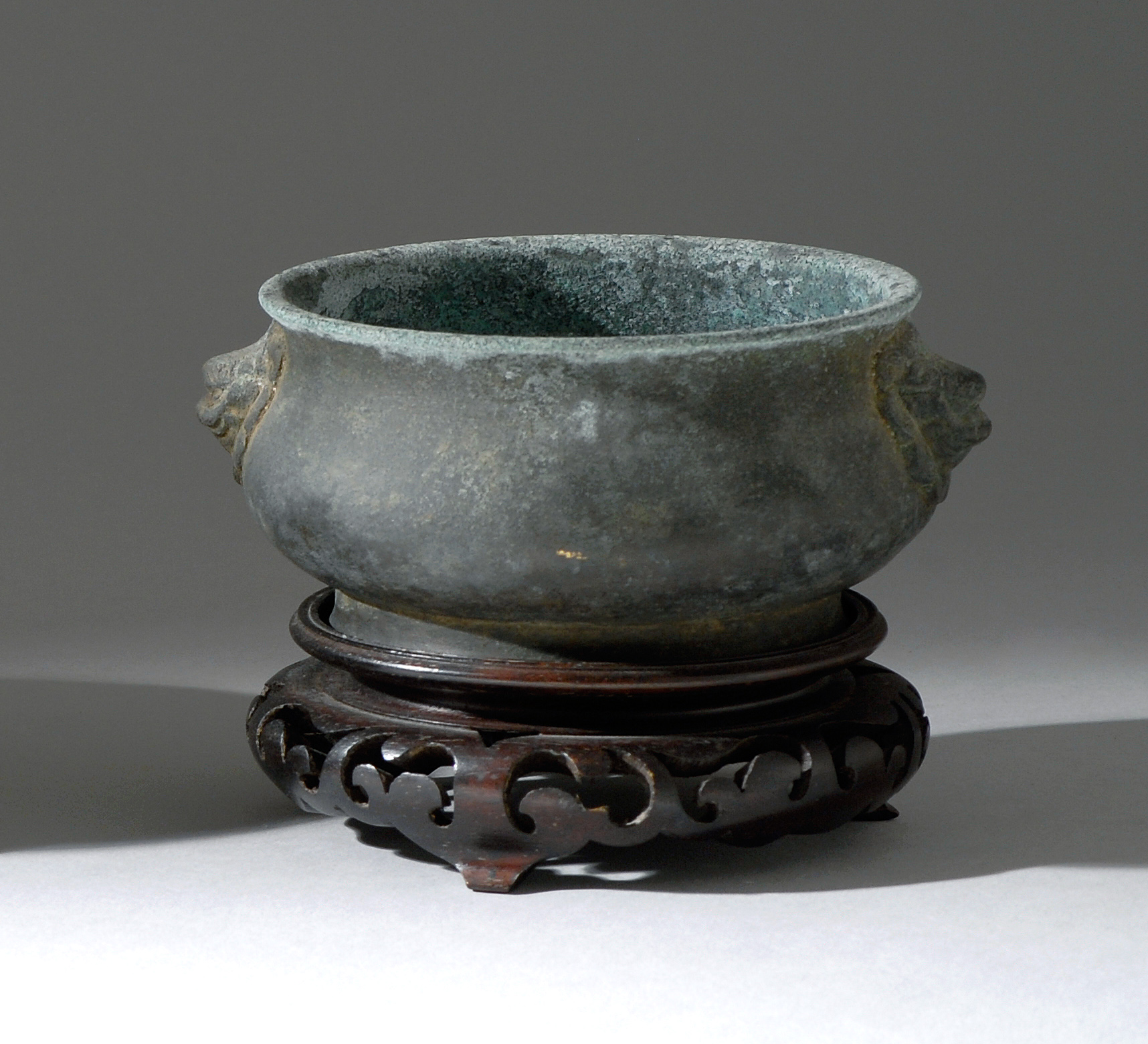 Appraisal: BRONZE CENSER Ming DynastyIn squat ovoid form with lion's-head handles