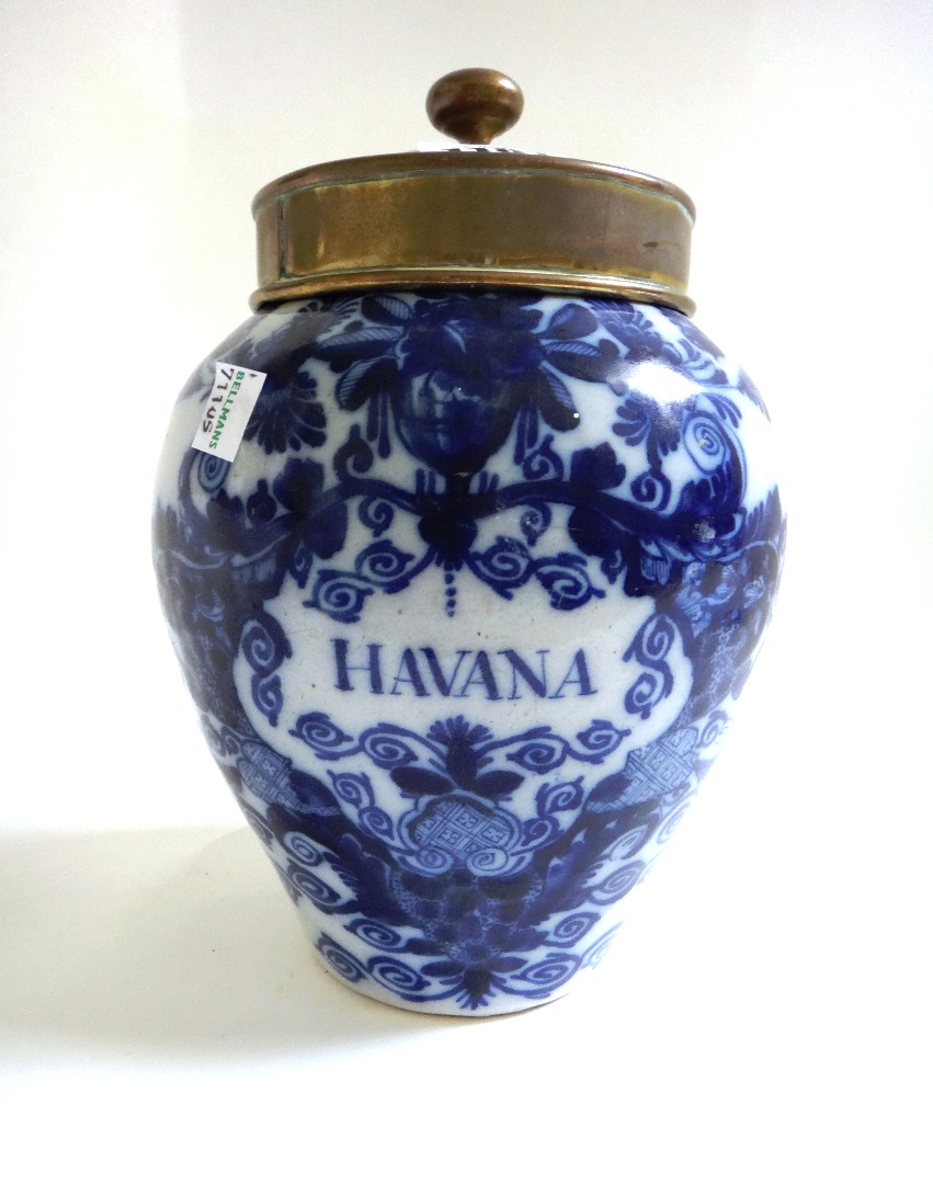 Appraisal: A Dutch Delft blue and white tobacco jar and brass