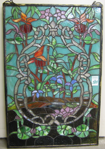 Appraisal: A STAINED AND LEADED GLASS WINDOW PANEL The floral scene