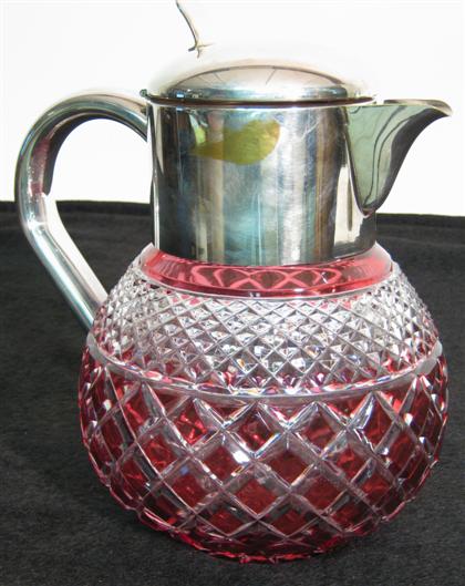 Appraisal: Silver plate mounted cranberry glass pitcher th century H in