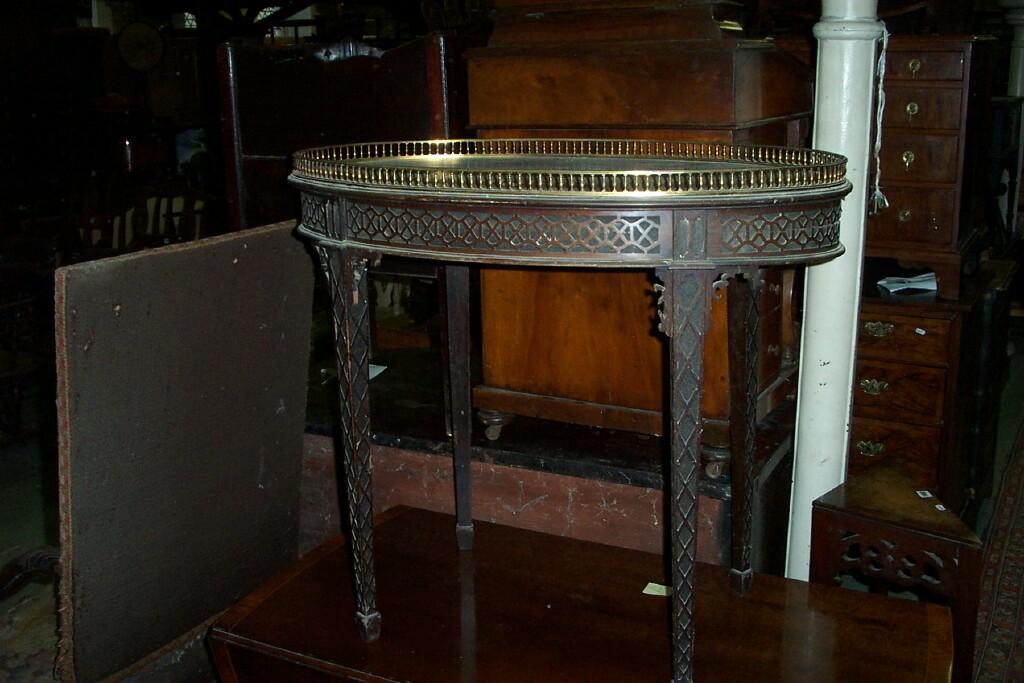 Appraisal: A late th century mahogany occasional table of oval form