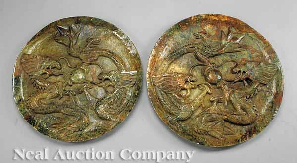 Appraisal: A Monumental Pair of Chinese Relief-Carved Hardstone Circular Wall Plaques