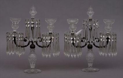 Appraisal: PAIR OF REGENCY METAL-MOUNTED CUT-GLASS TWO-LIGHT CANDELABRA Each ovoid faceted