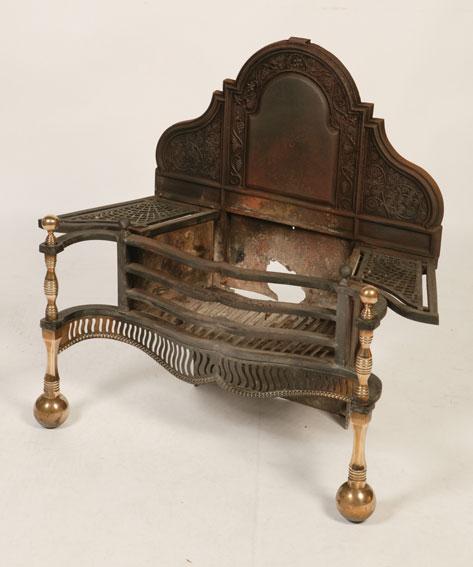 Appraisal: A CAST IRON AND BRASS MOUNTED FIRE BASKET with an