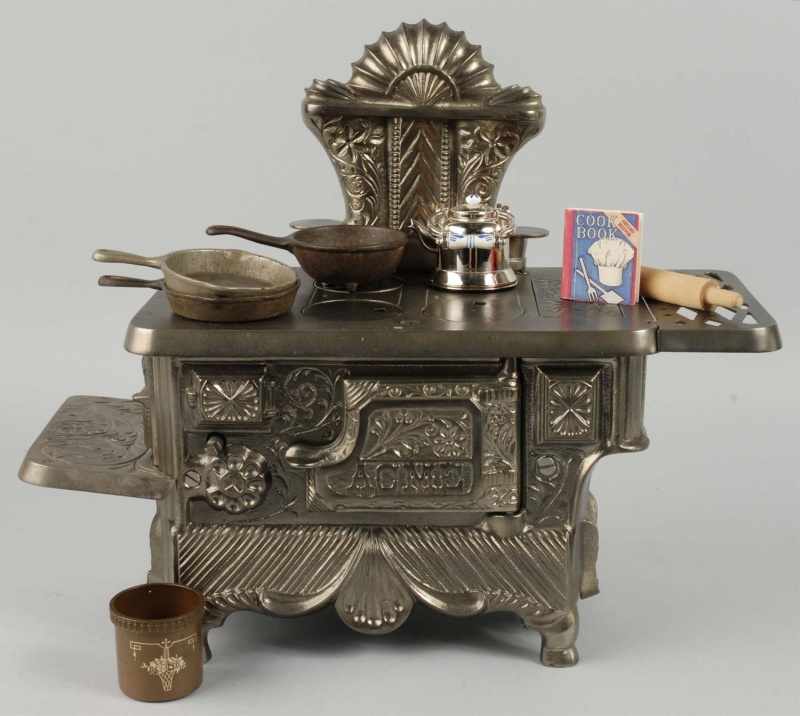 Appraisal: Cast Iron Stevens Acme Children's Stove Description Polished Includes accessories