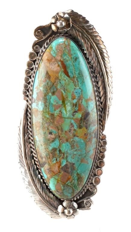 Appraisal: Sterling silver ring featuring a massive polished oval turquoise stone