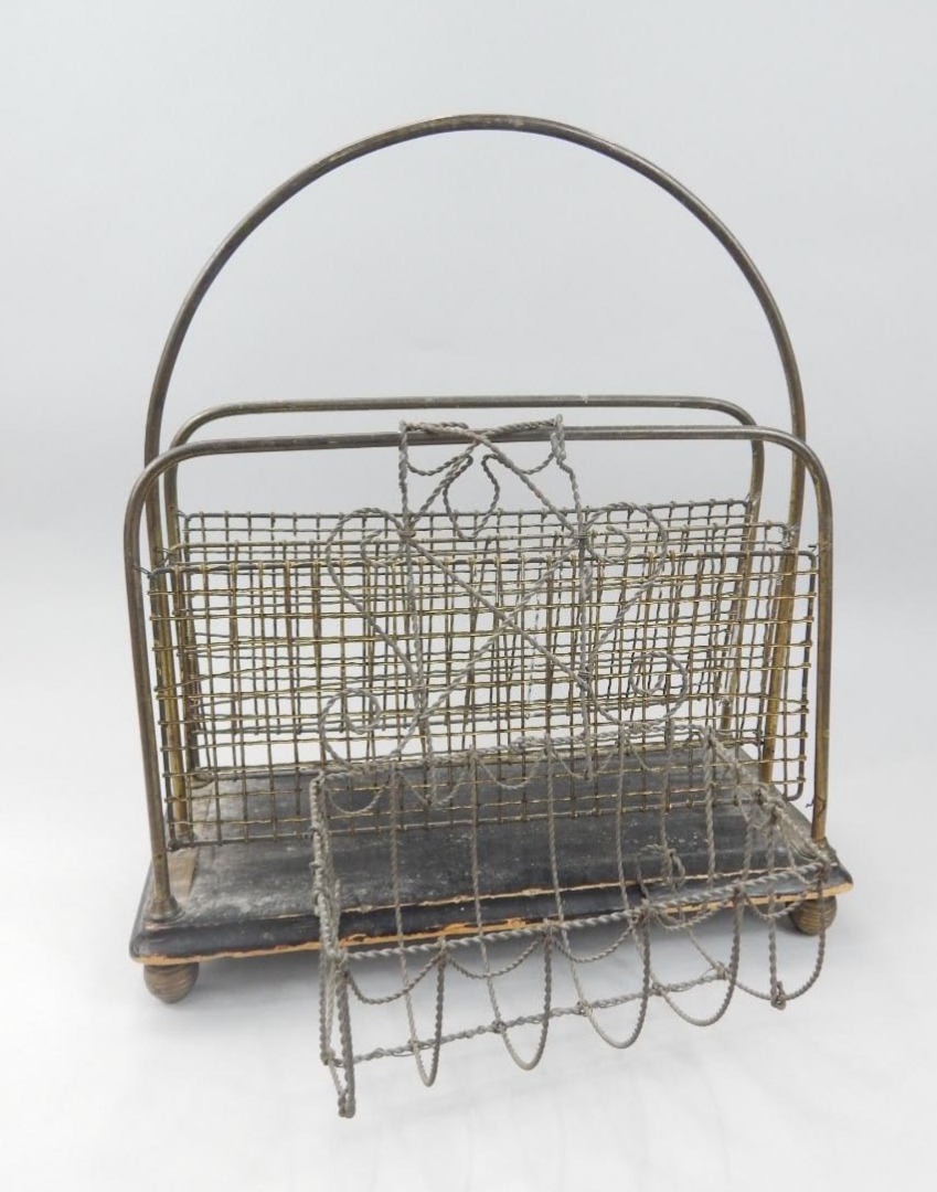 Appraisal: An early thC newspaper rack with a mesh work brass