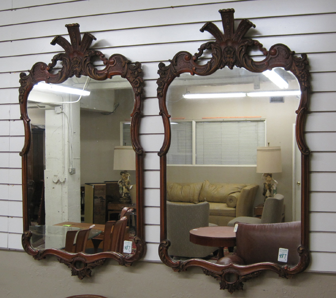 Appraisal: PAIR OF MAHOGANY FRAMED WALL MIRRORS attributed to The Saginaw