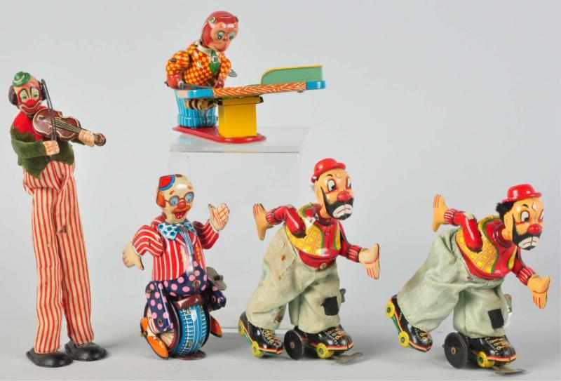 Appraisal: Lot of Tin Litho Wind-Up Toys Japanese Working Includes four