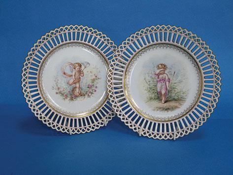 Appraisal: A PAIR OF DRESDEN CABINET PLATES with reticulated borders the