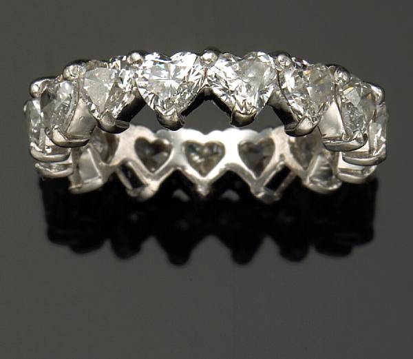 Appraisal: A heart-shape diamond and platinum eternity band estimated total diamond