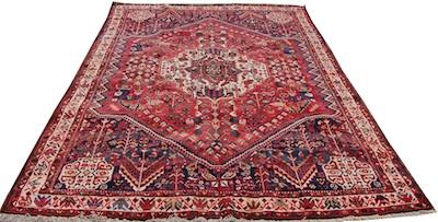 Appraisal: A Shiraz Carpet Approx '- x '- Floppy wool carpet