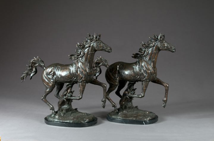 Appraisal: Large Pair of Continental Patinated Bronze Figures of Galloping Stallions