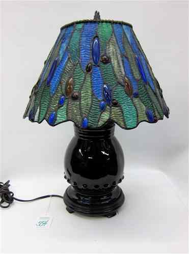 Appraisal: STAINED LEADED GLASS TABLE LAMP blue pottery based having a