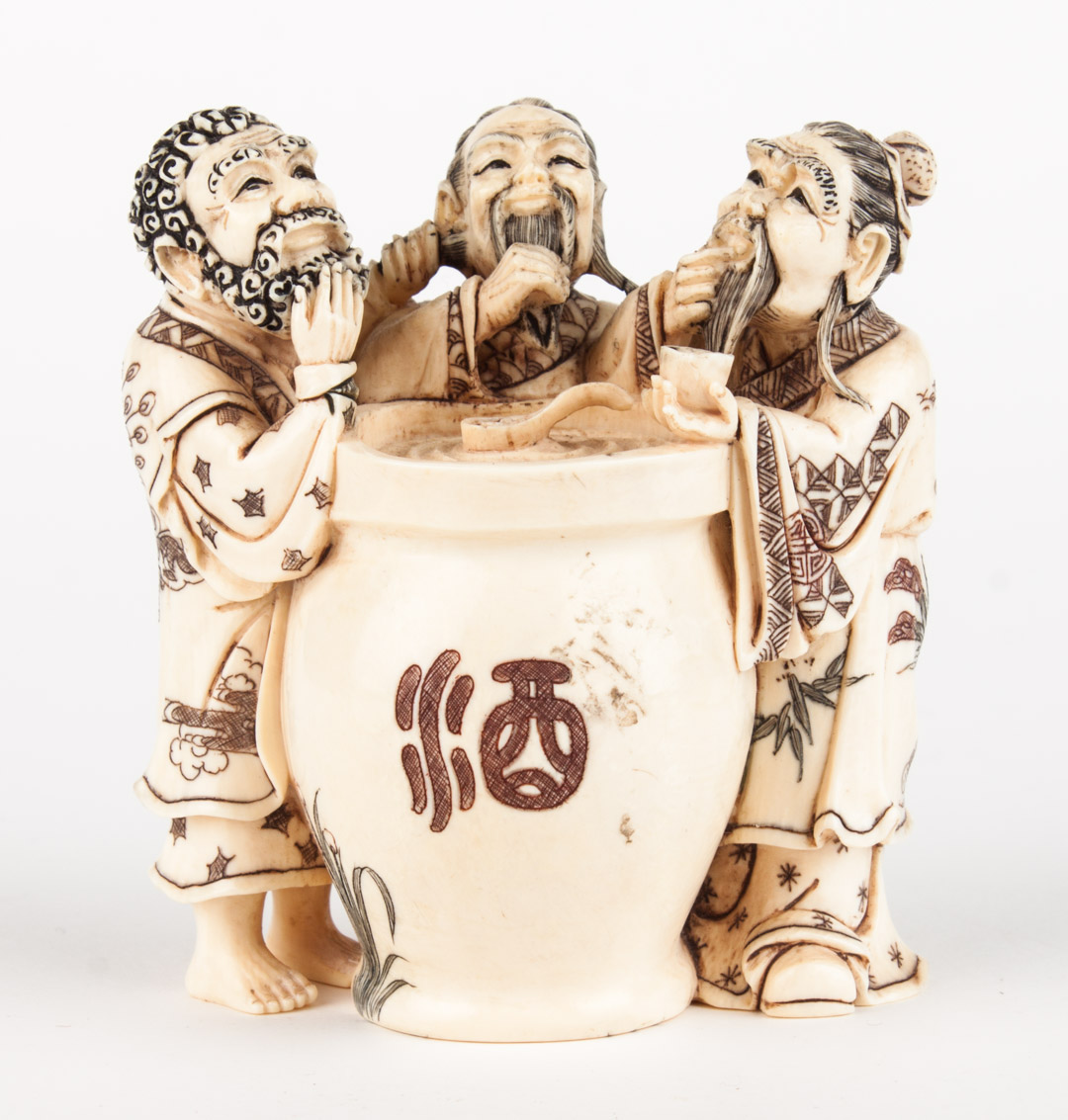 Appraisal: Japanese carved ivory figural group ink and polychrome highlights of