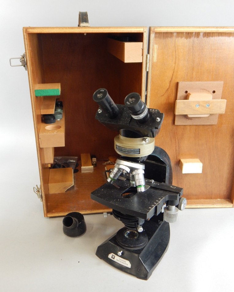 Appraisal: A Vickers instrument binocular laboratory microscope with various fittings in