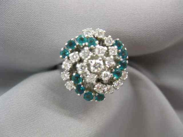 Appraisal: Emerald Diamond Ring round diamonds totaling carat and round emeralds