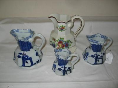 Appraisal: A SET OF THREE DAVENPORT IRONSTONE GRADUATED JUGS of panelled