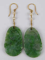 Appraisal: A pair of carved jade and seed pearl earrings with