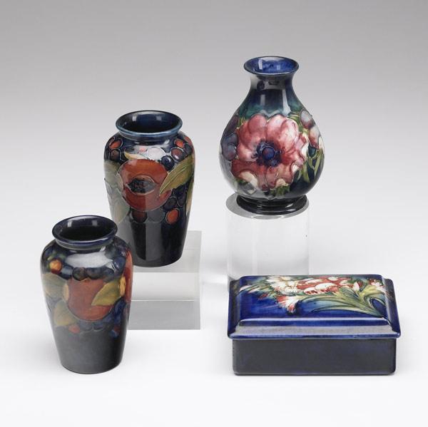 Appraisal: MOORCROFT Pair of Pomegranate cabinet vases Anemone vase with corseted