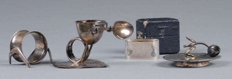 Appraisal: Lot of Figural Napkin Rings Description First is a bead