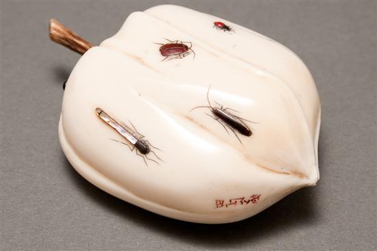 Appraisal: Japanese carved ivory persimmon with polychromed and mother-of-pearl inlaid insects