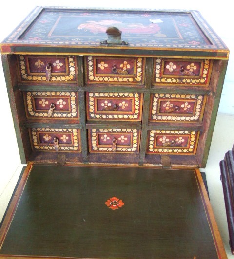 Appraisal: An Indian decorated hardwood small box with a hinged fall