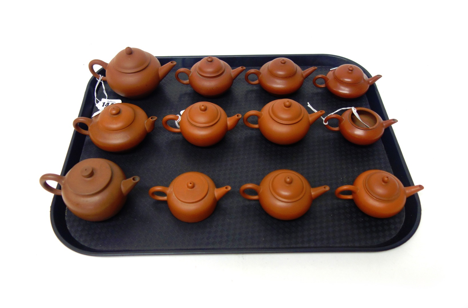 Appraisal: A group of twelve Chinese Yixing teapots and eleven covers