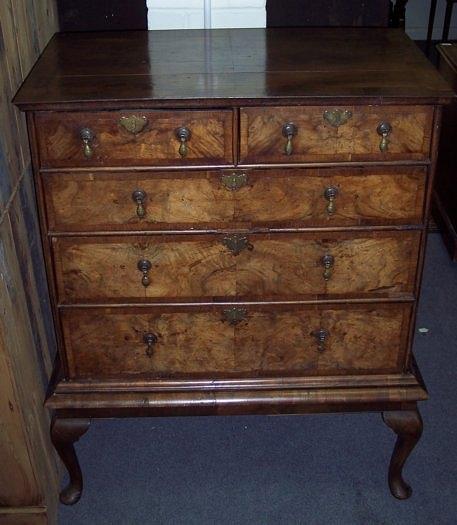 Appraisal: An th Century walnut and crossbanded chest on stand fitted