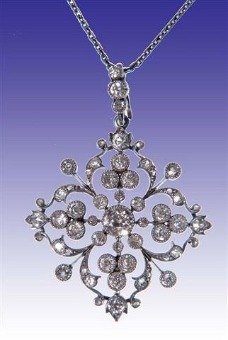 Appraisal: A DIAMOND SET PENDANT in the form of a star