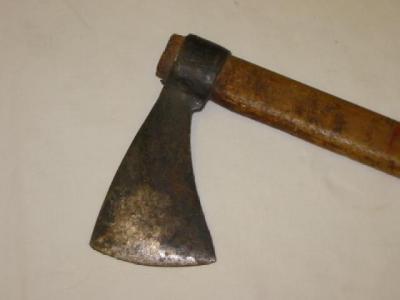 Appraisal: A TOMAHAWK with curved wrought iron blade straight ash wood