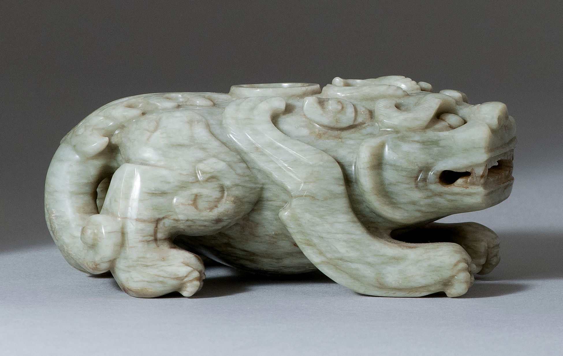 Appraisal: CHICKEN BONE JADE WRITER'S COUPE th th CenturyIn the form