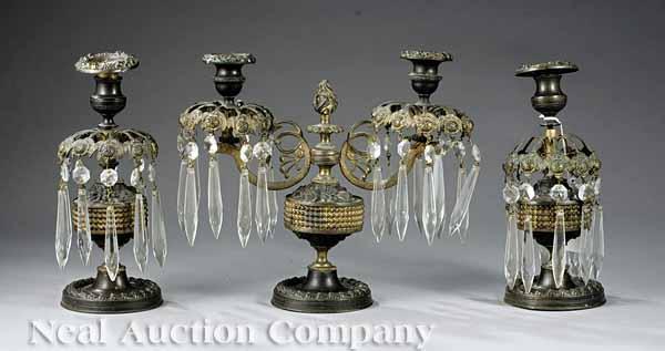 Appraisal: A French Patinated Bronze and Repouss Brass Three-Piece Mantel Garniture