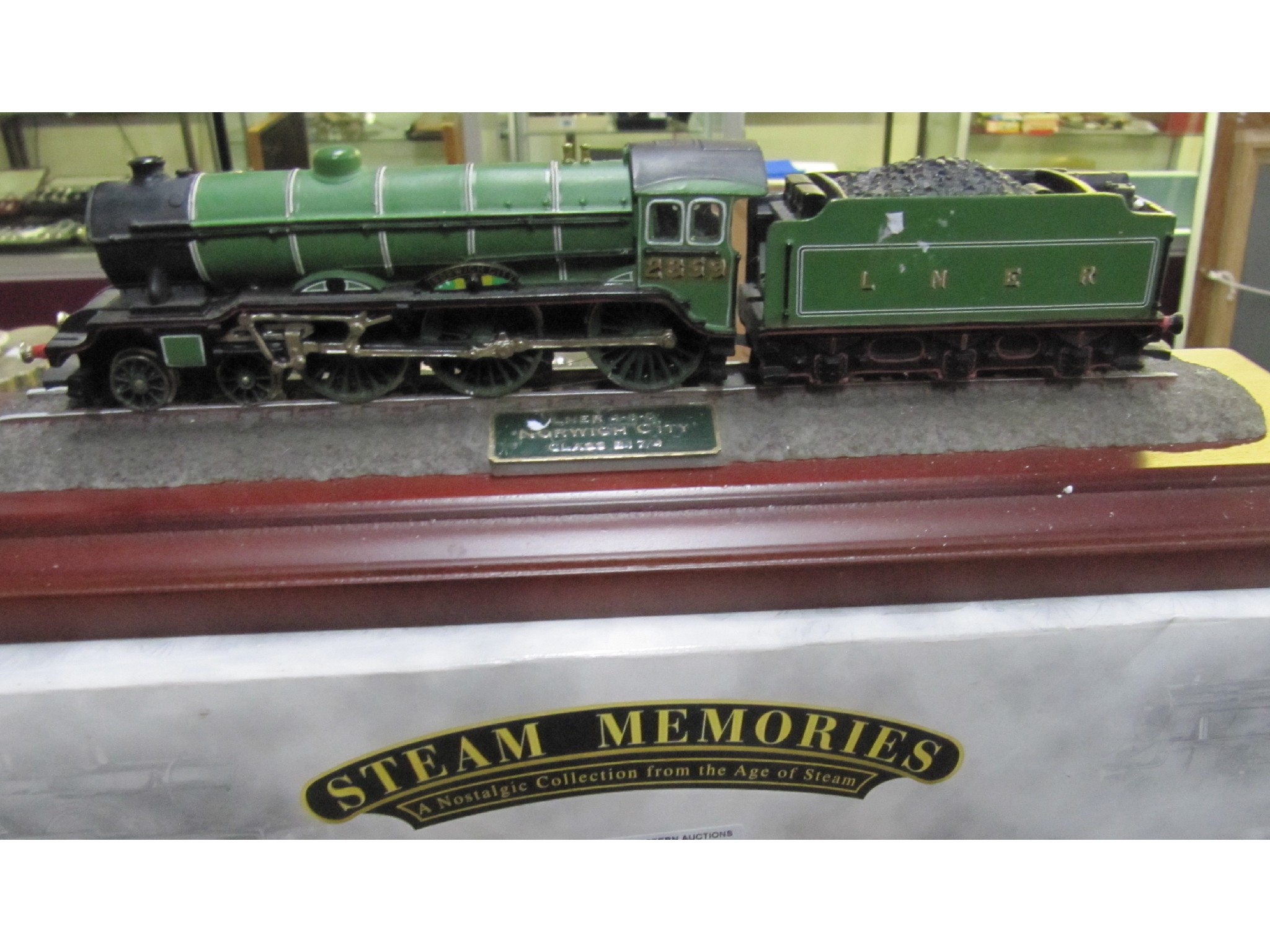 Appraisal: A lot comprising three mounted model Hornby train engines and