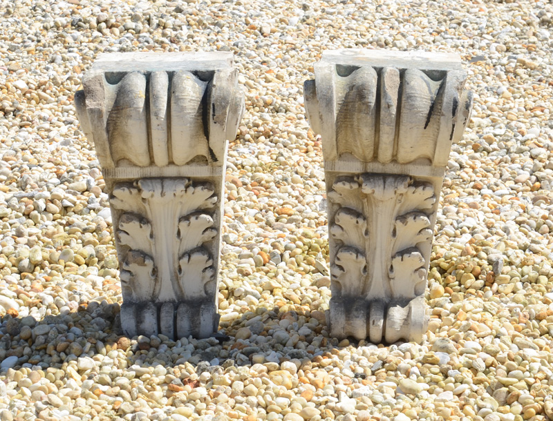 Appraisal: PAIR OF NEOCLASSICAL STYLE COMPOSITION CORBELS Each with a rectangular