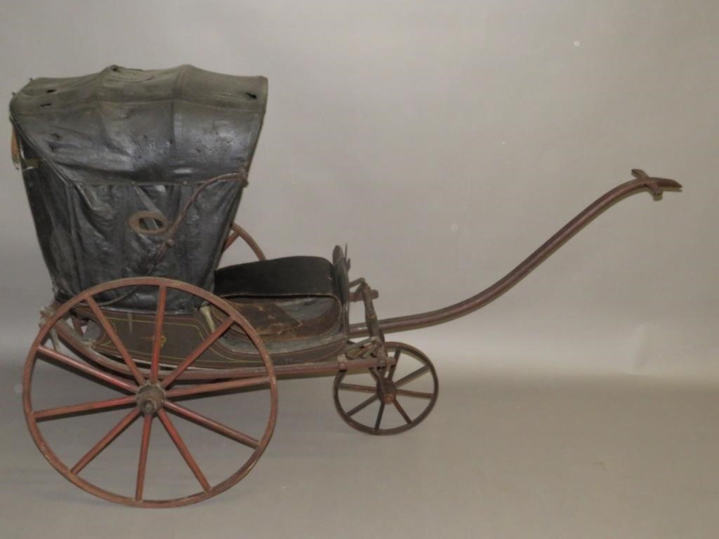 Appraisal: CHILD'S CARRIAGEca untouched pull carriage with long handle original leather