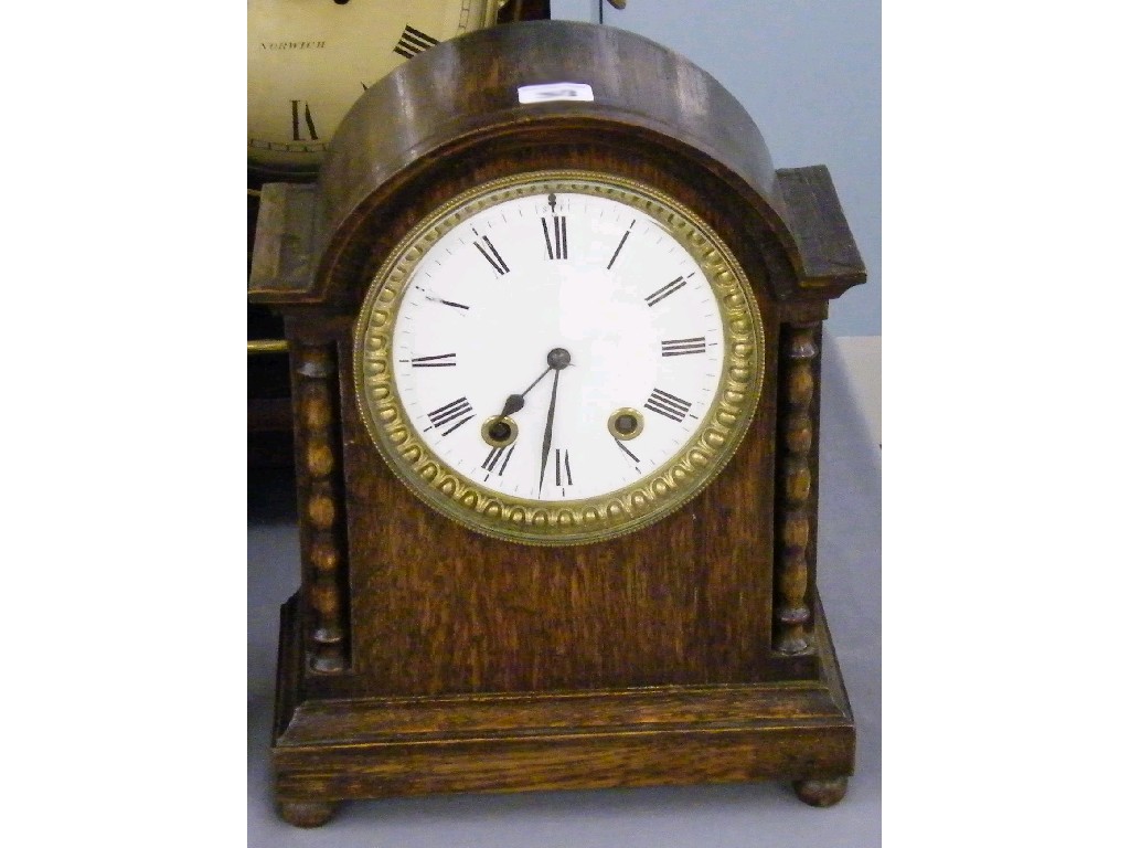 Appraisal: French oak fourteen day ting-tang mantel clock the white dial