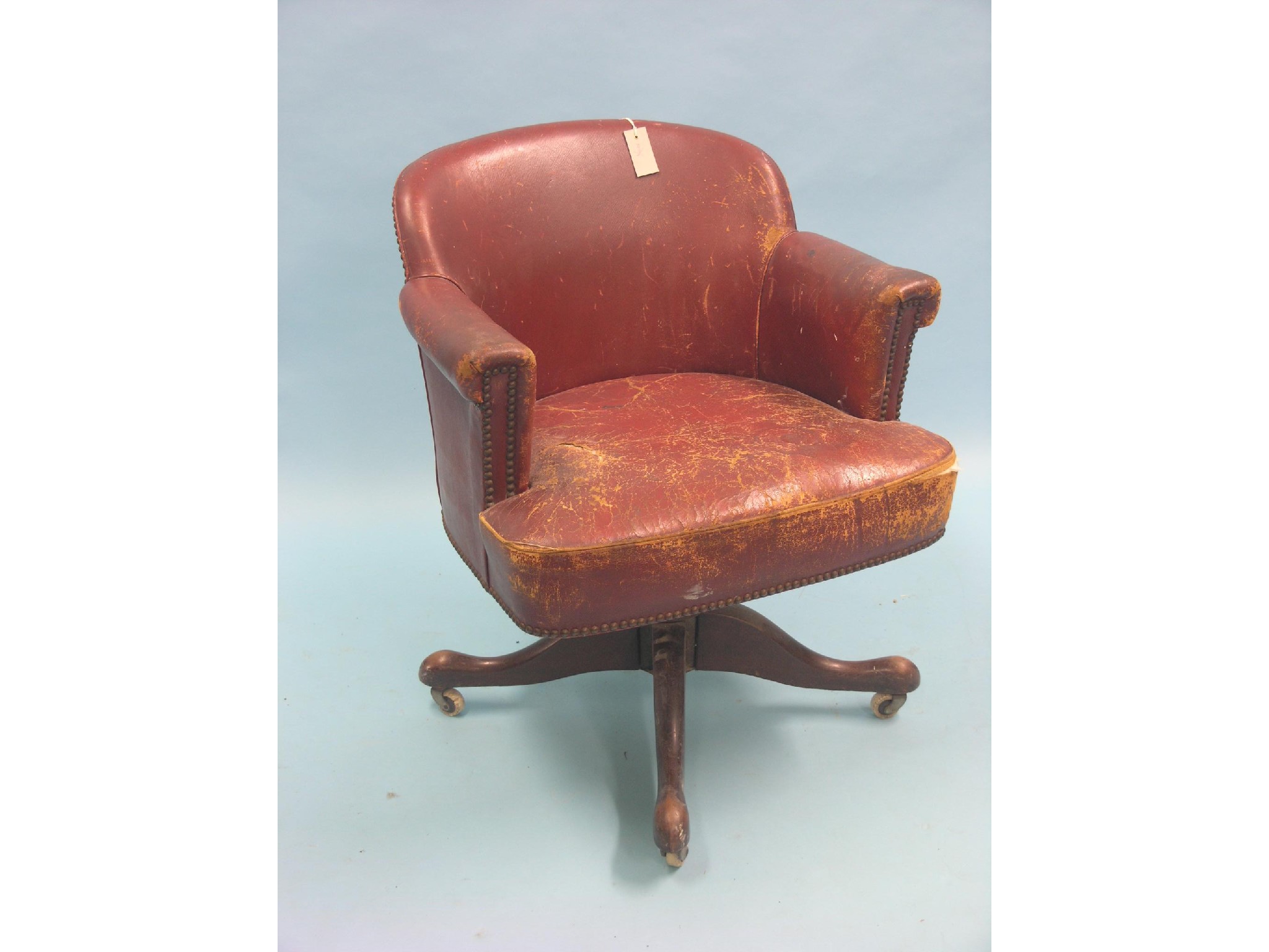 Appraisal: An early th century office elbow chair upholstered in a