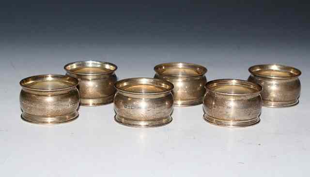 Appraisal: A SET OF SIX SILVER NAPKIN RINGS Chester troy oz