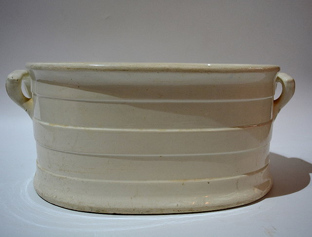 Appraisal: A Victorian plain white pottery oval foot bath cm