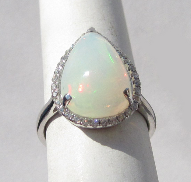 Appraisal: OPAL DIAMOND AND FOURTEEN KARAT WHITE GOLD RING with round-cut