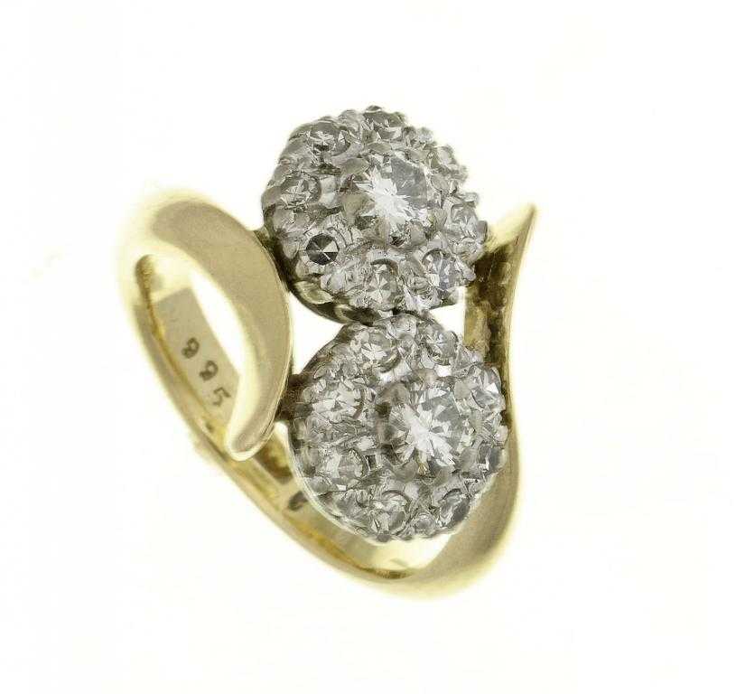 Appraisal: A DIAMOND CROSS-OVER RING of two clusters gold hoop marked