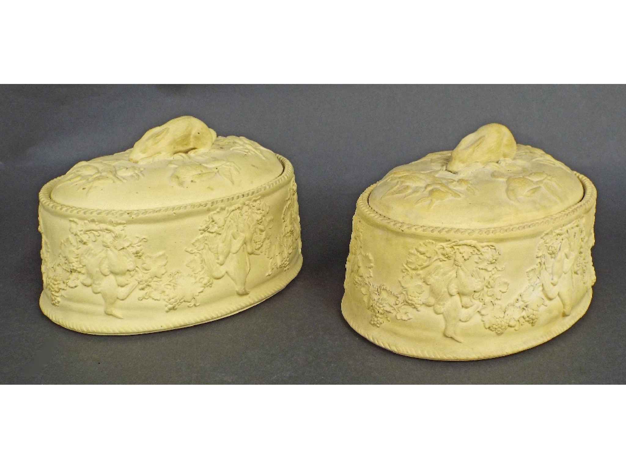 Appraisal: Pair of Wedgwood buff earthenware tureens decorated in relief with